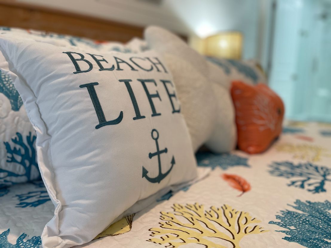 Beach Life Pillow on the Bed